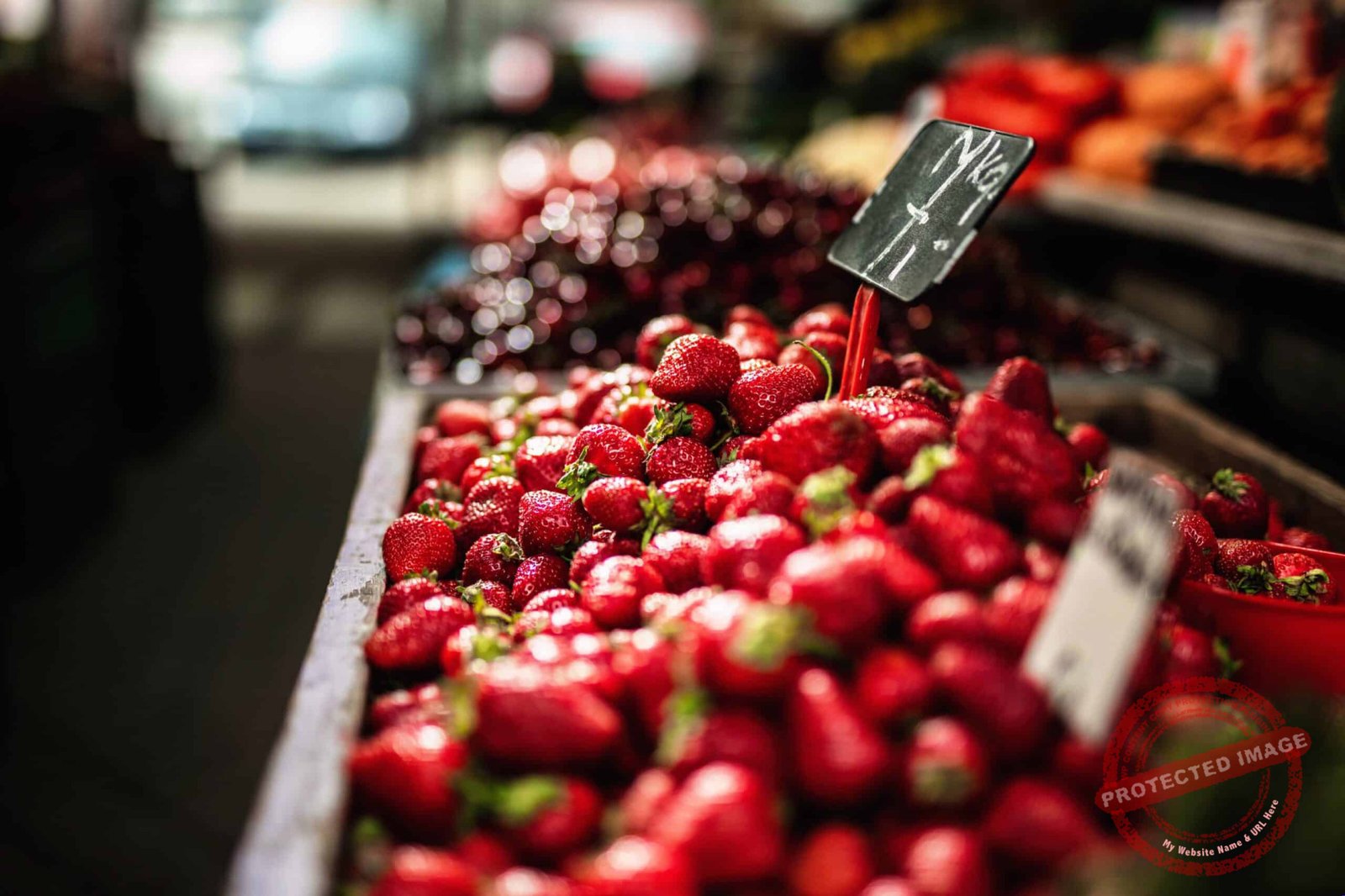 Boxes of delicious strawberries in a vegetable market